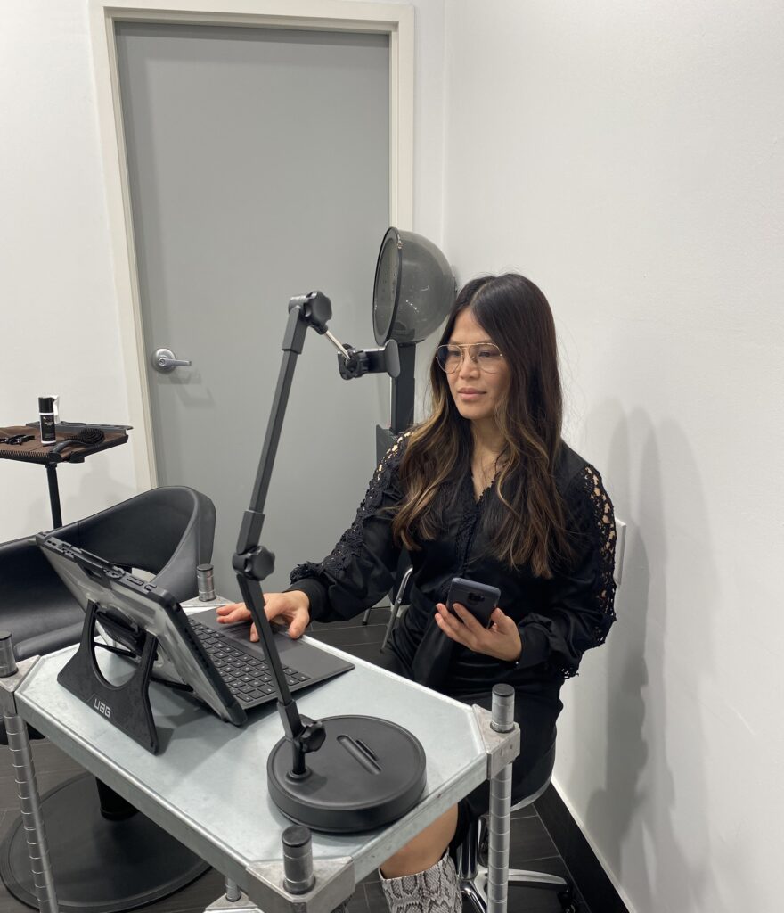 Hairstylist conducting a virtual consultation